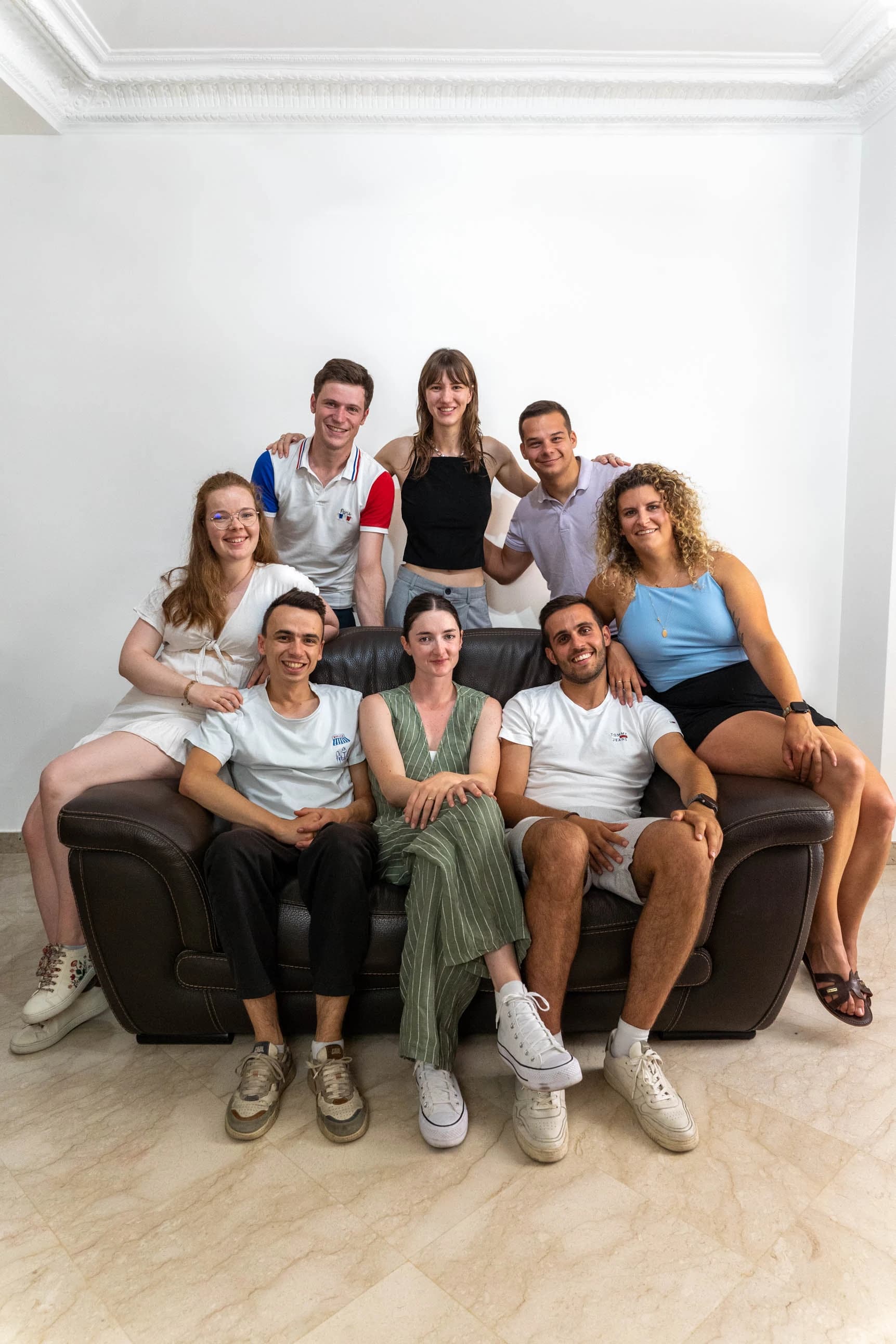 Group of friends sitting and relaxing on a sofa